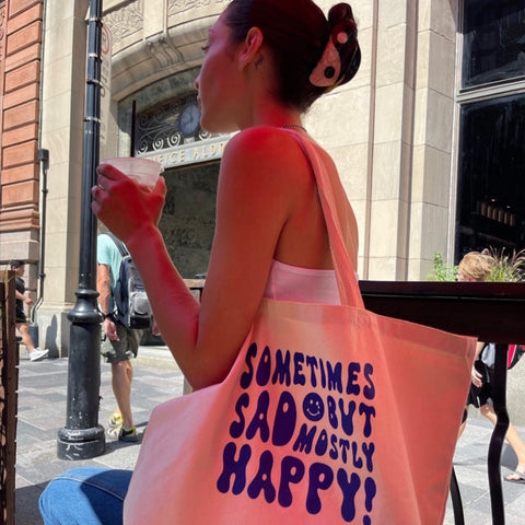 'sometimes sad, but mostly happy' canvas tote