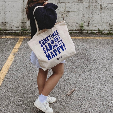 'sometimes sad, but mostly happy' canvas tote